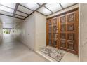 Inviting entryway featuring a decorative front door, neutral walls, and a hallway, showcasing a warm welcome at 3035 Countryside Blvd # 15B, Clearwater, FL 33761