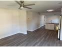 Open concept living area with new floors, recessed lighting, and adjacent eat-in kitchen at 8306 N Orleans Ave, Tampa, FL 33604