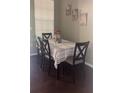 Dining room featuring hardwood floors, neutral paint, and a decorative chandelier at 5125 Palm Springs Blvd # 13107, Tampa, FL 33647