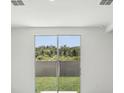 Sliding glass doors open to a well-maintained backyard at 1839 Brekey Way, Zephyrhills, FL 33541