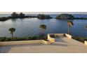 Large balcony with lounge chairs offering a relaxing outdoor space and water views in this community at 5915 Sea Ranch Dr # 415, Hudson, FL 34667