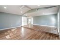 Bright living room with vaulted ceilings and hardwood floors for an open and airy feel at 10237 Bannock St, Spring Hill, FL 34608