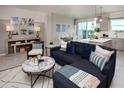 Beautifully decorated living room with a comfortable sectional sofa and stylish decor at 42854 Park View Dr Way, Punta Gorda, FL 33982