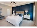Inviting bedroom with a feature wall, plush bedding, and coordinated nightstands at 42854 Park View Dr Way, Punta Gorda, FL 33982