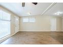 Spacious living room with ample natural light, new floors, and neutral walls at 1314 Larsen Ln, Tampa, FL 33619