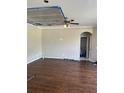 Bright living area with laminate flooring, ceiling fan and closet for storage, primed for upgrades at 11317 Village Brook Dr, Riverview, FL 33579