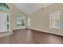 Open concept entryway with high ceilings, new floors, and large windows, offering lots of natural light at 4432 Huddlestone Dr, Wesley Chapel, FL 33545