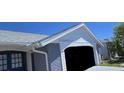 Shot of the side of the house that includes the garage entrance at 3309 Rock Valley Dr, Holiday, FL 34691