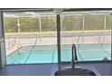 A glimpse of the outdoor pool through the kitchen window at 3309 Rock Valley Dr, Holiday, FL 34691