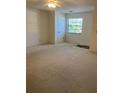 Bright bedroom with neutral carpeting and a large window allowing ample natural light at 4152 66Th Street W Cir # 4152, Bradenton, FL 34209
