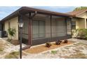 Charming home with a screened-in porch and landscaped garden, offering a serene outdoor living space at 4152 66Th Street W Cir # 4152, Bradenton, FL 34209