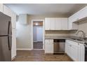Modern kitchen with stainless steel appliances, granite counters, and wood-look floors at 912 Magnolia Dr, Clearwater, FL 33756