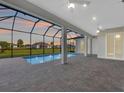 Inviting screened-in pool area with brick pavers and outdoor space perfect for relaxation at 235 Rotonda S Blvd, Rotonda West, FL 33947