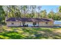 Charming single-story brick home featuring a well-manicured lawn at 21940 Dupree Dr, Land O Lakes, FL 34639