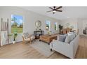 Inviting living room and dining area with large windows offering scenic outdoor views at 3772 Bath Ln, North Port, FL 34288