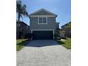Stunning two-story home featuring a well-maintained lawn, and a two-car garage at 3721 Heron Island Dr, New Port Richey, FL 34655