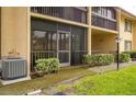 Condo with screened in porch and manicured landscaping showcasing comfortable outdoor living at 721 83Rd N Ave # 108, St Petersburg, FL 33702
