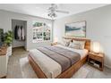 Cozy bedroom boasts a plush rug, natural light, and minimalist decor for a restful retreat at 6902 Lakeview Ct, Tampa, FL 33634