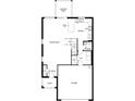 Open-concept first floor plan featuring a large great room, kitchen, and garage access at 9418 Sandy Bluffs Cir, Parrish, FL 34219