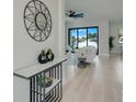 Open-concept layout with views from the foyer to a living area with sliding doors to the backyard at 3339 Elkcam Blvd, Port Charlotte, FL 33952