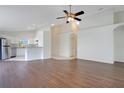 Spacious open-concept living room with hardwood floors and seamless flow into the kitchen at 5009 72Nd E Ct, Bradenton, FL 34203