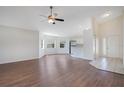 Inviting living area with hardwood floors, natural light, and convenient access to the kitchen and entry at 5009 72Nd E Ct, Bradenton, FL 34203
