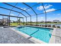 Stunning pool with water views is perfect for relaxation and entertainment at 3061 Hollow Hickory Pl, Wesley Chapel, FL 33543