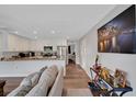 Open-concept living room flowing into a kitchen with stainless steel appliances at 7210 14Th N St, St Petersburg, FL 33702