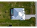 Birds eye view of property showing pool, modern roofline, paver driveway, and screen enclosed pool at 205 Rotonda S Blvd, Rotonda West, FL 33947