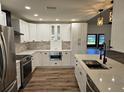 Spacious renovated kitchen featuring stainless appliances, custom cabinets, and modern countertops at 2055 Lakeview Dr, Clearwater, FL 33763