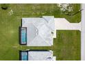 Aerial view showcases the property's well-maintained landscaping and private pool area at 223 Rotonda S Blvd, Rotonda West, FL 33947
