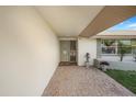 Inviting front entrance featuring a tiled walkway, well-kept lawn and decorative plant at 4043 Topsail Trl, New Port Richey, FL 34652