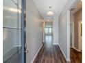 Inviting entryway with wood floors, leading to an open and airy living space at 507 Daylily Blvd, Nokomis, FL 34275