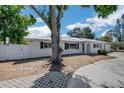 Charming single-story home with a well-maintained lawn, a metal roof and a new fence at 5817 26Th W St, Bradenton, FL 34207