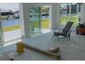 Bright sunroom with sliding glass doors and waterfront views at 5186 Fleming St, Port Charlotte, FL 33981