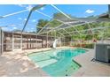Inviting screened-in pool area perfect for relaxation and entertainment, featuring a slide and ample seating at 414 Mahogany Dr, Seffner, FL 33584