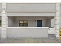Charming covered entry with painted porch with front-facing window and blue entry door at 5744 Calais N Blvd # 4, St Petersburg, FL 33714