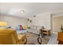 Bright living room with tile flooring, neutral walls, and comfortable seating arrangement at 5744 Calais N Blvd # 4, St Petersburg, FL 33714