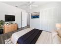 Contemporary bedroom with a sleek design, featuring ample closet space and a minimalist aesthetic at 837 Dolphin Nw Ave, Port Charlotte, FL 33948