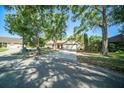 Pleasant one-story house with a spacious driveway and an attractive front lawn at 3419 Pleasant Lake Dr, Tampa, FL 33618