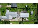 An aerial view showcasing the house and its backyard at 5213 Keene Dr, Plant City, FL 33566