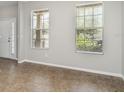 Welcoming living area with tile floors and large windows that bring in plenty of natural light at 541 Vista Ridge Dr, Ruskin, FL 33570