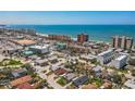 Expansive aerial shot capturing the scenic coastline, highlighting the neighborhood's close proximity to the beautiful beach at 15406 2Nd E St, Madeira Beach, FL 33708