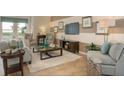 Inviting living room with neutral color palette, comfortable seating, stylish decor, and plush rug at 6179 Notre Dame Ter, North Port, FL 34291