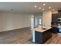 Open-concept living room and kitchen featuring modern finishes and an inviting atmosphere at 6179 Notre Dame Ter, North Port, FL 34291