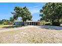Charming single-story home with lush landscaping and a convenient covered carport at 6801 16Th N St, St Petersburg, FL 33702