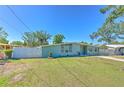 Beautiful single-story home with a green lawn and charming curb appeal at 505 Hedge Row Rd, Brandon, FL 33510