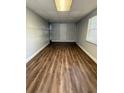 An empty room that features modern flooring and an exit door at 4617 John Bell Jr Dr, Tampa, FL 33610