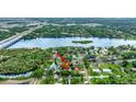 Stunning aerial view showcasing the waterfront property and surrounding natural beauty at 9503 Alice Ln, Riverview, FL 33578
