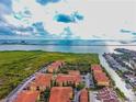 Aerial shot showcasing the community's waterfront location, lush surroundings, and residential buildings at 4333 Bayside Village Dr # 310, Tampa, FL 33615